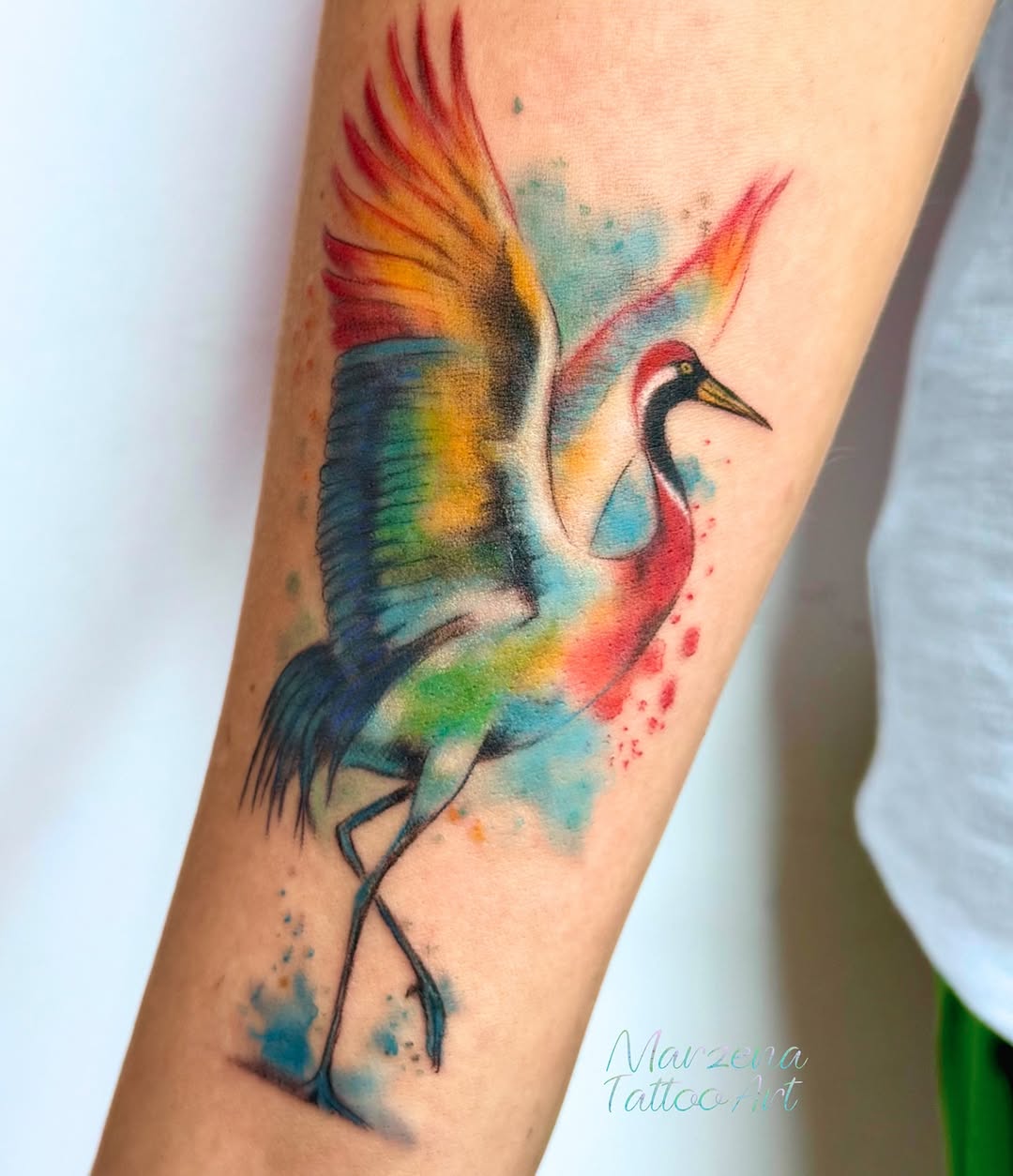 Tatuaż żurawia na przedramieniu — akwarela, marzenatattooart, Kraków